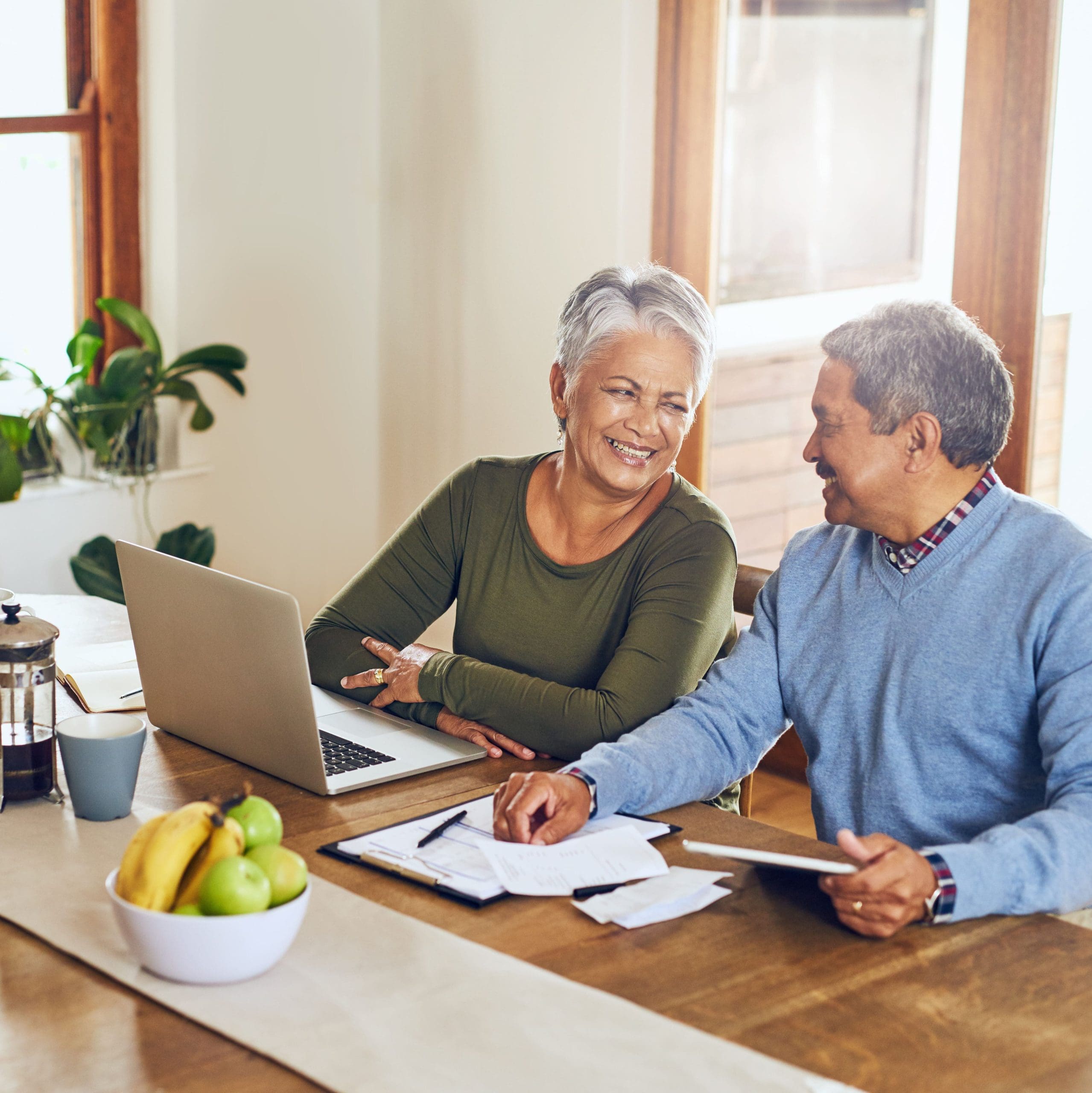Finance, laptop and happy senior couple with bills, paperwork and documents for life insurance. Retirement, pension and elderly man and woman on computer for mortgage payment, investment and budget.