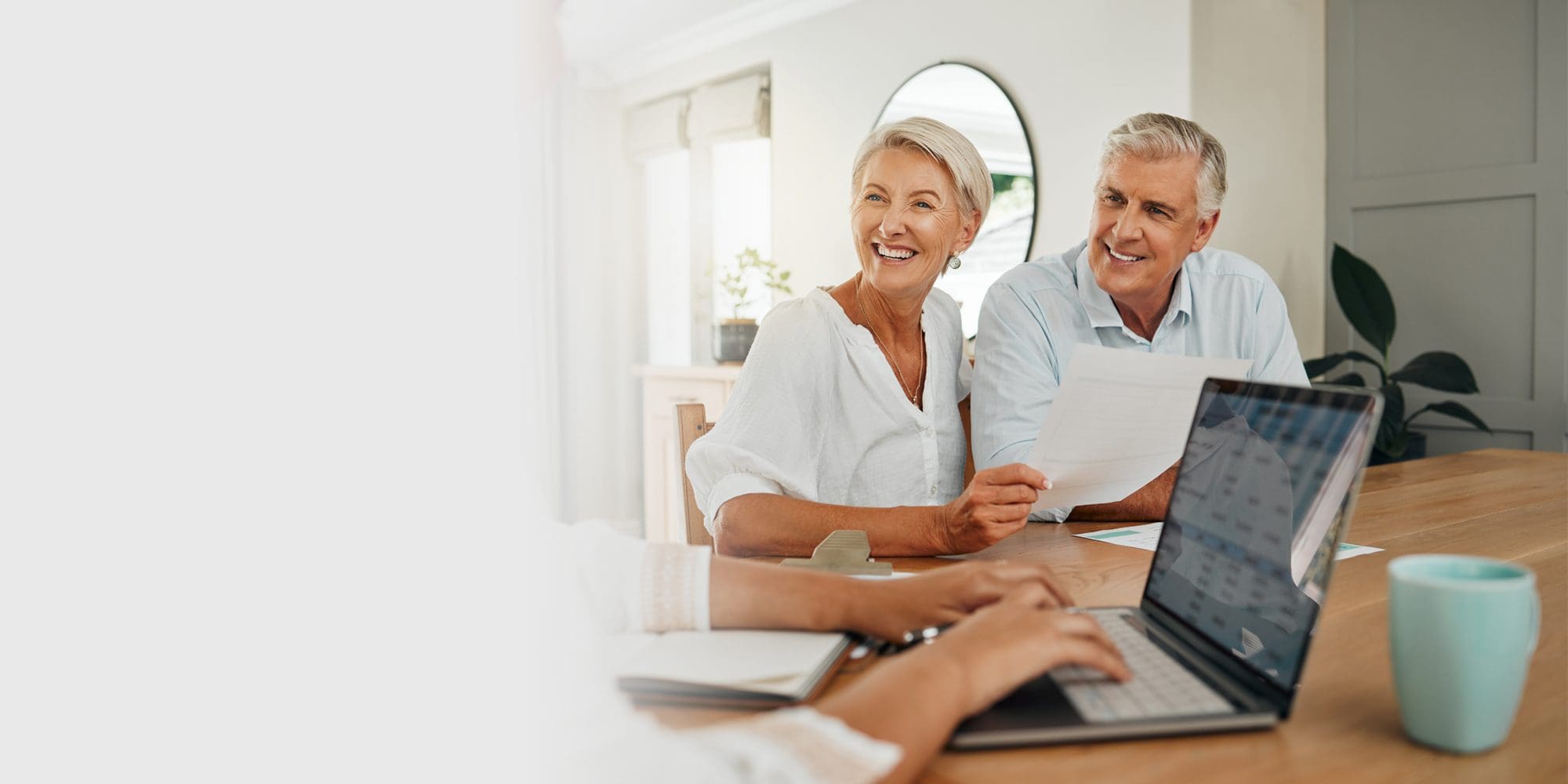 Retirement, savings and couple planning finance, insurance and investments in living room. Man and woman and seniors communication, talking and discuss wealth with internet banking and laptop at home