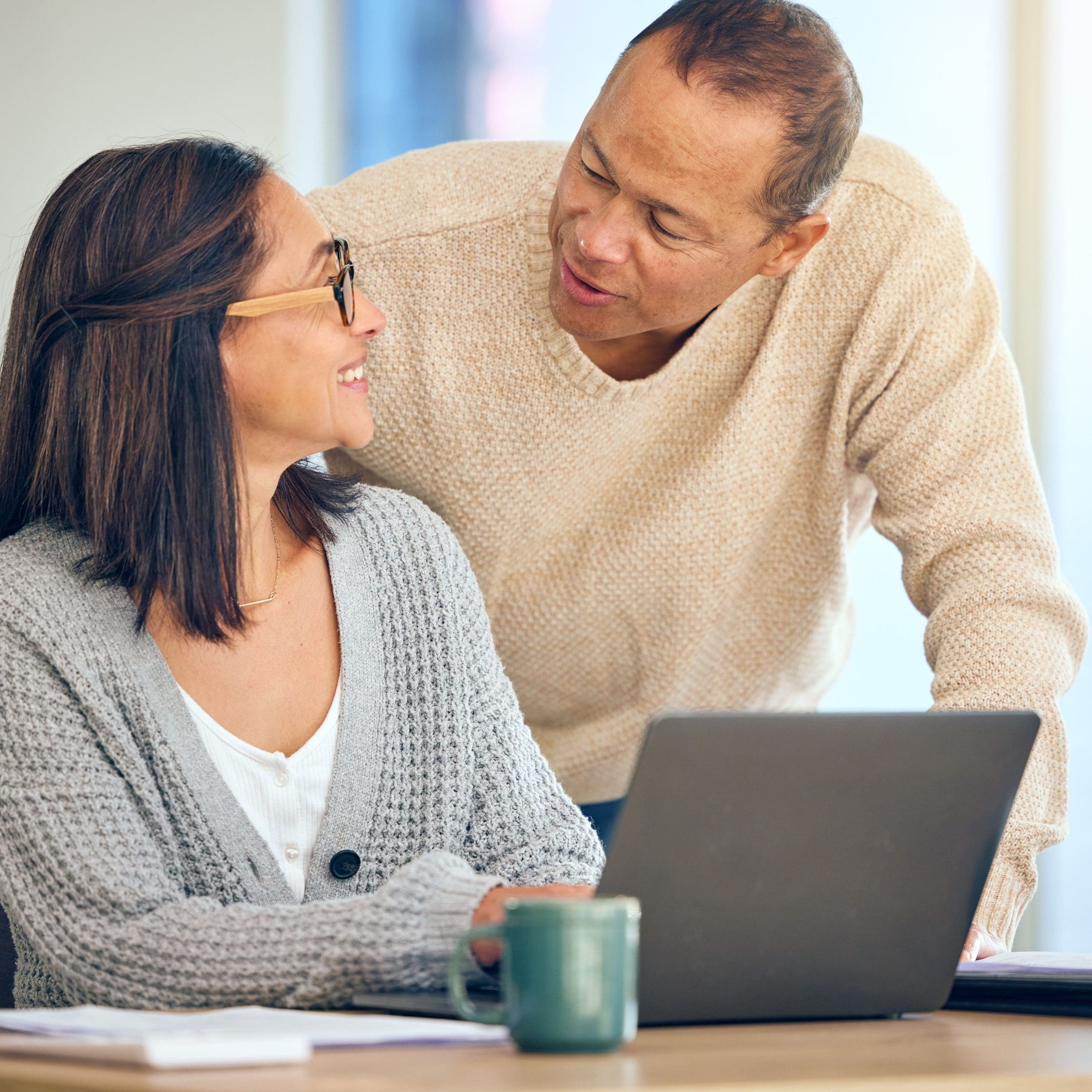 Love, retirement and senior couple with laptop, investment and pension fund planning. Retired, man and woman with search online, budget and paying debt for mortgage, insurance and finance growth